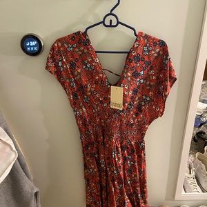 floral romper, never worn with tags size large